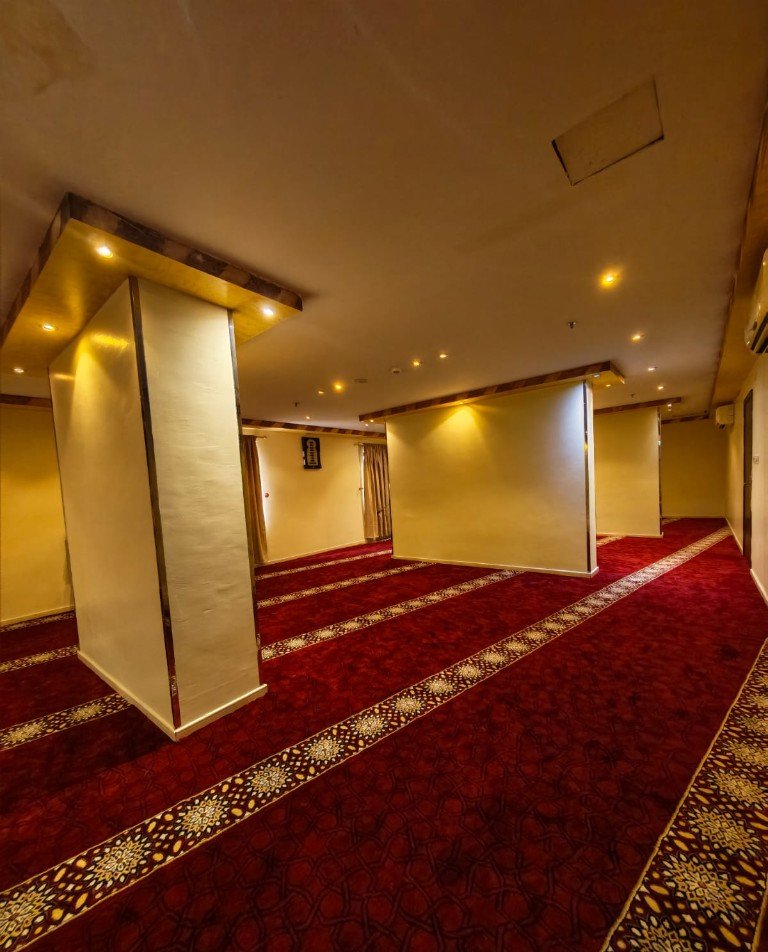Prayer hall with a red patterned carpet